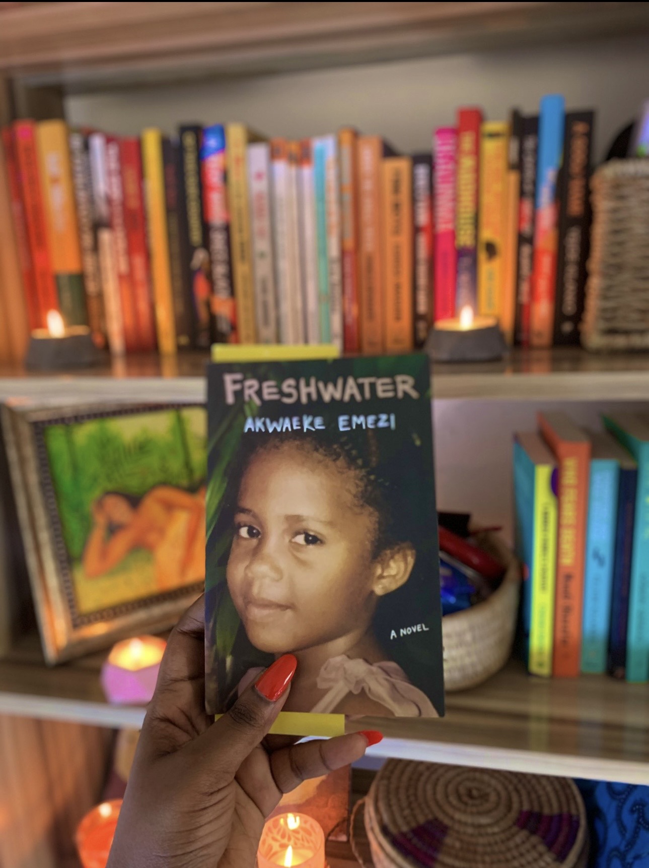 Ibi Kontein with a selection of books featured on Ibi's Book Corner
